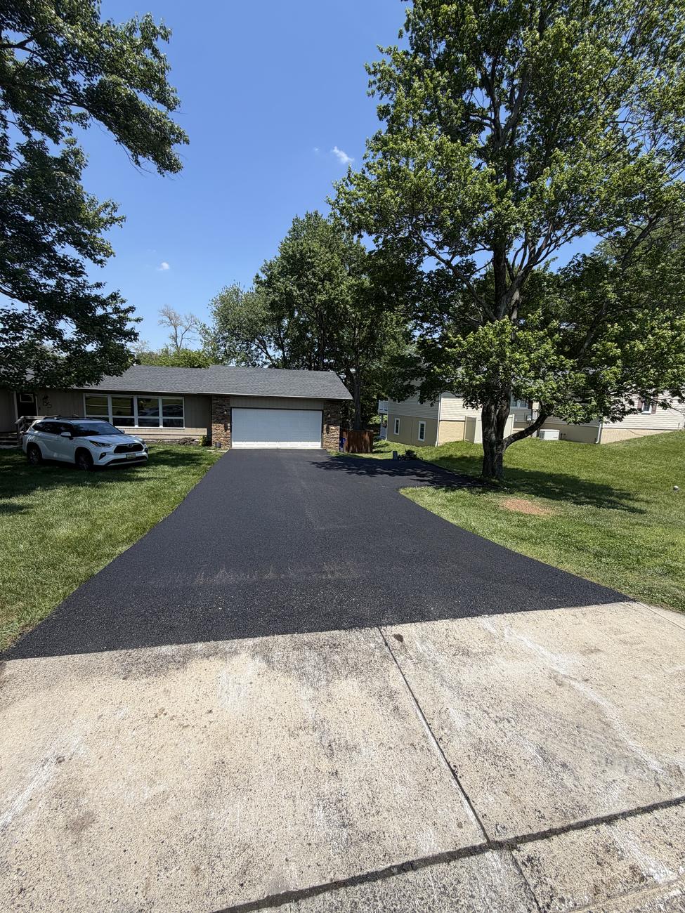 New asphalt tied clean to old concrete