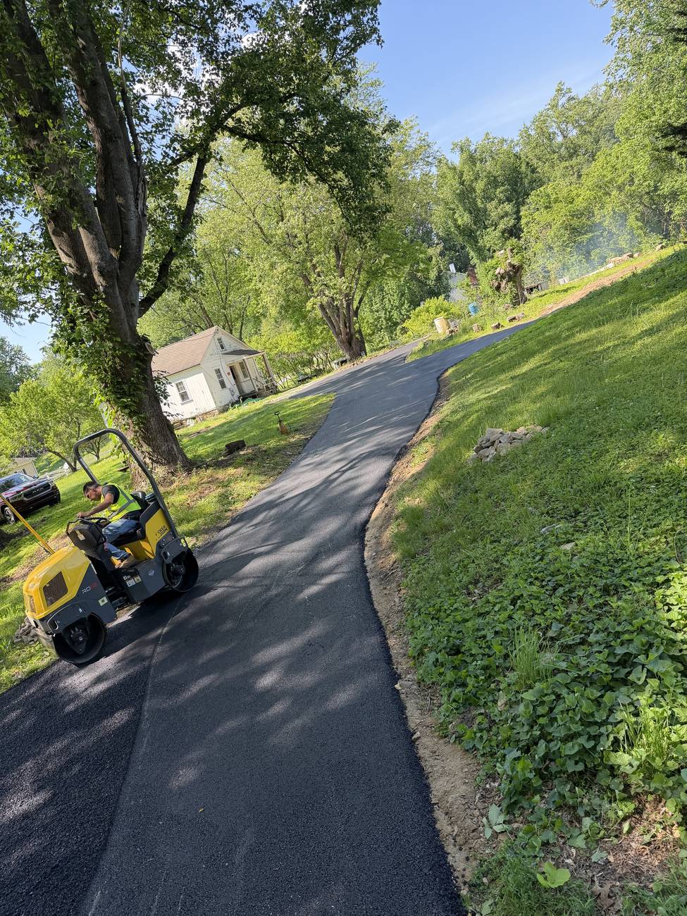 Rolling a fresh driveway mat tight
